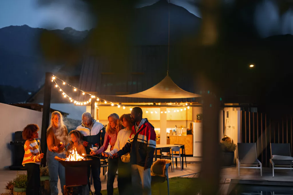 People gathered around a Fireplace